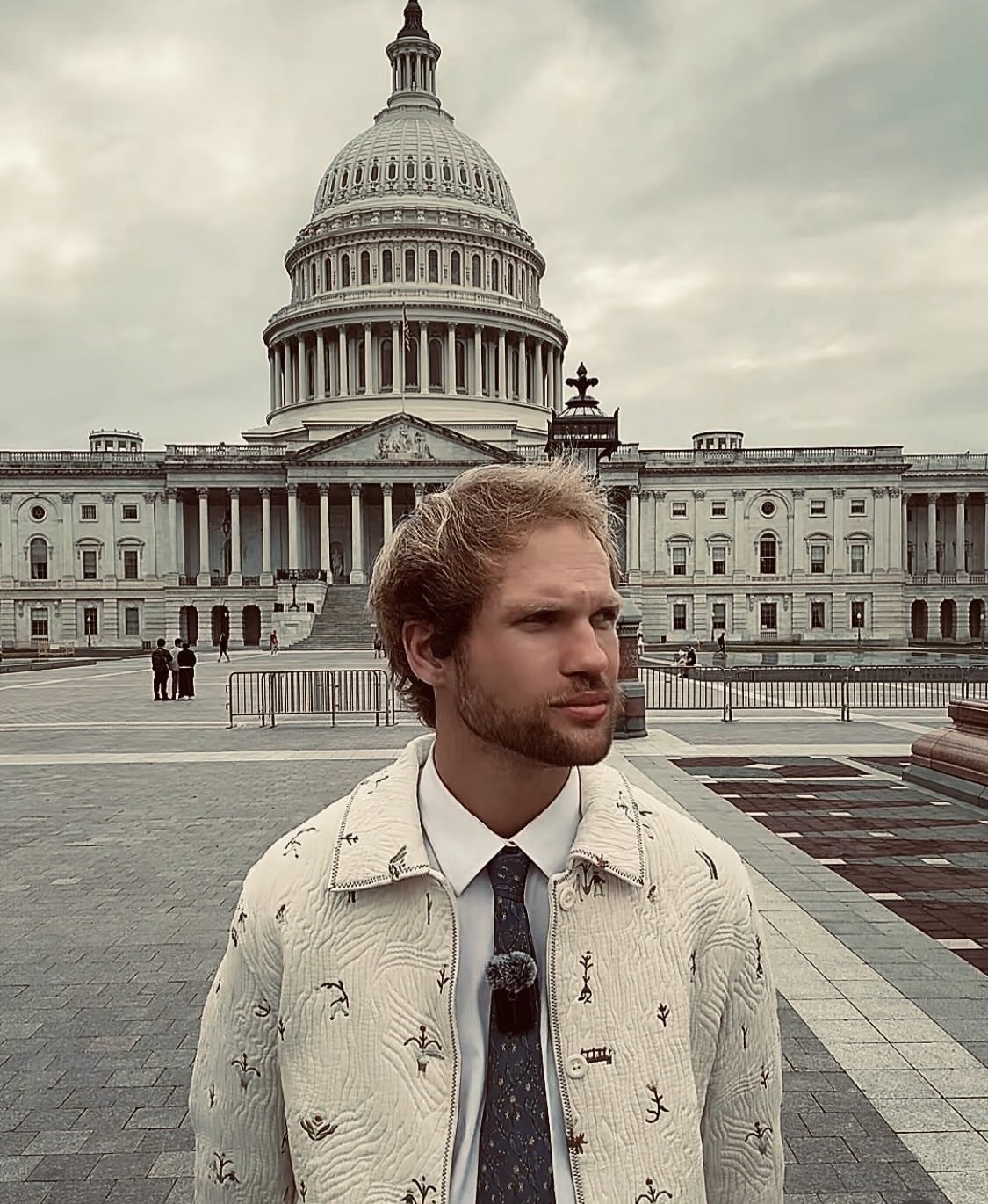 Evan Corneliussen standing in front of the United States Capitol